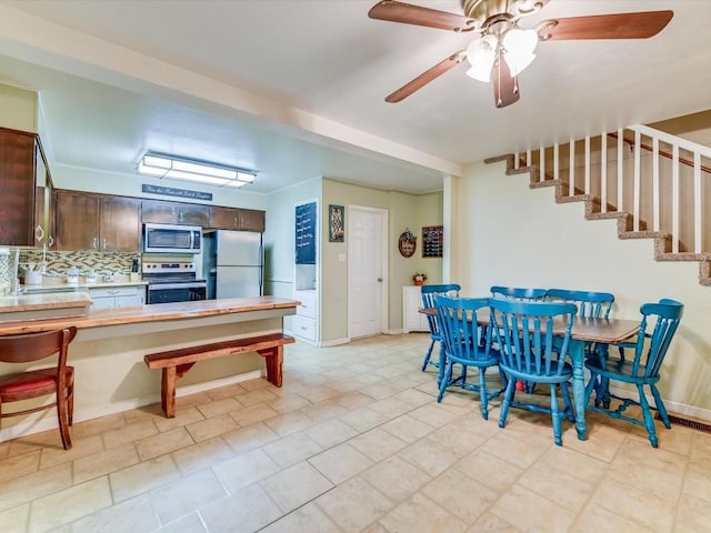 1576 Westview Court Dr, Canyon Lake, TX 78133 - dining room featuring stairs, a ceiling fan, and baseboards