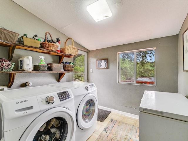 1576 Westview Court Dr, Canyon Lake, TX 78133 - laundry area featuring washing machine and dryer, baseboards, a textured wall, and a textured ceiling