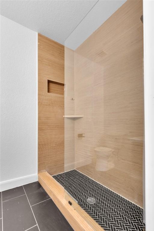 776 Butcher St, New Braunfels, TX 78130 - full bath featuring a tile shower and tile patterned flooring