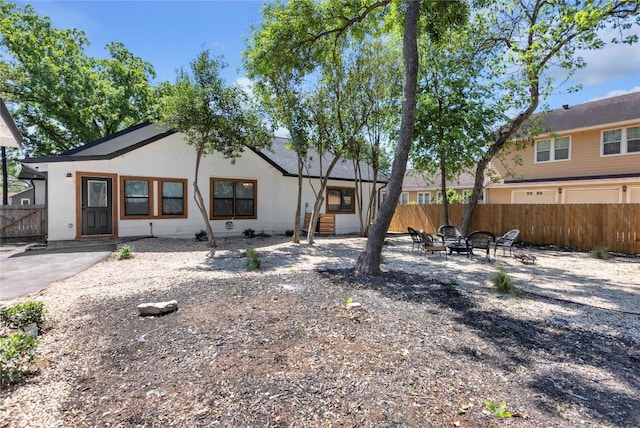 776 Butcher St, New Braunfels, TX 78130 - back of property featuring a fire pit