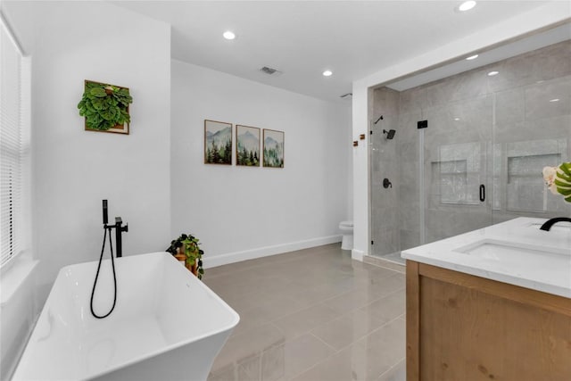 776 Butcher St, New Braunfels, TX 78130 - full bathroom featuring a shower stall, recessed lighting, a soaking tub, toilet, and vanity
