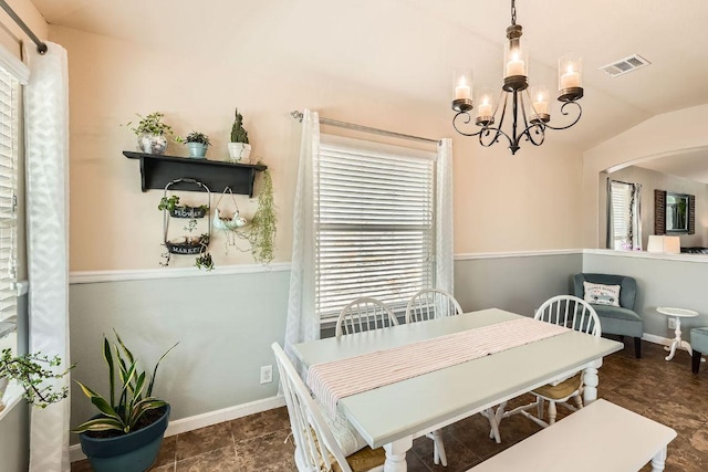 134 Sassafras St, Hutto, TX 78634 - dining space with healthy amount of natural light, a chandelier, arched walkways, baseboards, and lofted ceiling