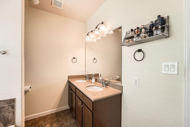 134 Sassafras St, Hutto, TX 78634 - full bath featuring double vanity, baseboards, and tile patterned flooring