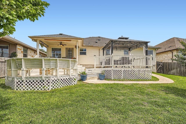 134 Sassafras St, Hutto, TX 78634 - back of house with a deck, a ceiling fan, and a gazebo