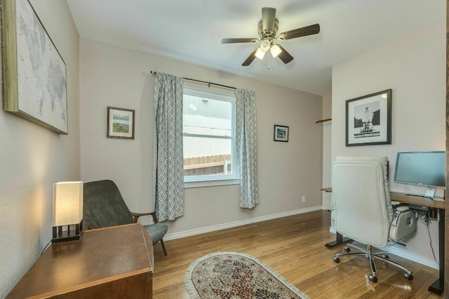 1125 Byers Ln, Austin, TX 78753 - office with wood finished floors, ceiling fan, and baseboards