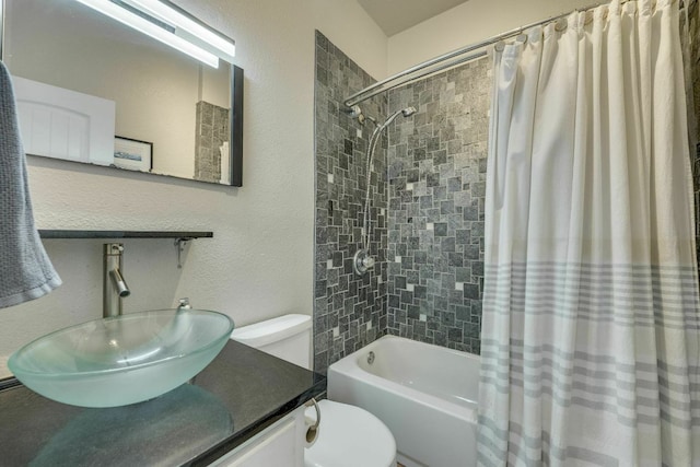 1125 Byers Ln, Austin, TX 78753 - full bath featuring toilet, shower / bath combo with shower curtain, vanity, and a textured wall