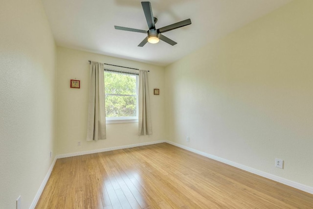 1125 Byers Ln, Austin, TX 78753 - unfurnished room featuring light wood finished floors, ceiling fan, and baseboards
