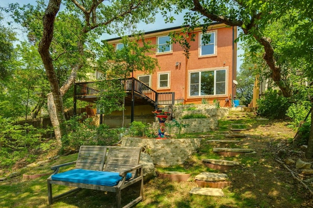 1125 Byers Ln, Austin, TX 78753 - rear view of property with stairs, a wooden deck, and stucco siding