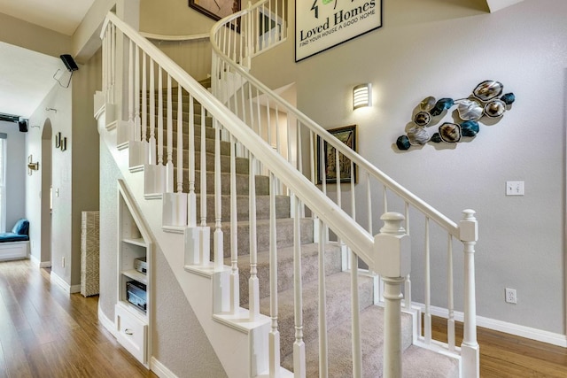 1125 Byers Ln, Austin, TX 78753 - staircase with wood finished floors and baseboards
