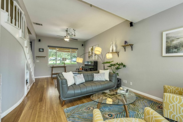 1125 Byers Ln, Austin, TX 78753 - living area featuring a ceiling fan, wood finished floors, and baseboards