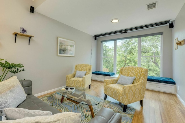 1125 Byers Ln, Austin, TX 78753 - living room featuring baseboards, light wood-type flooring, and recessed lighting