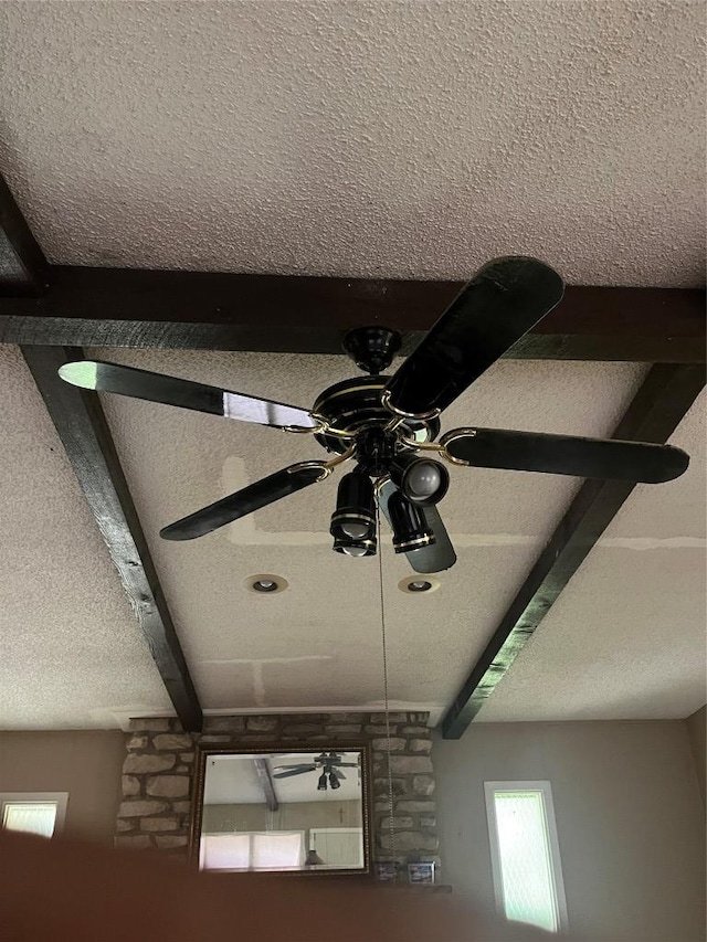 200 N Walton St, Granger, TX 76530 - detailed view of a ceiling fan, a textured ceiling, and beam ceiling