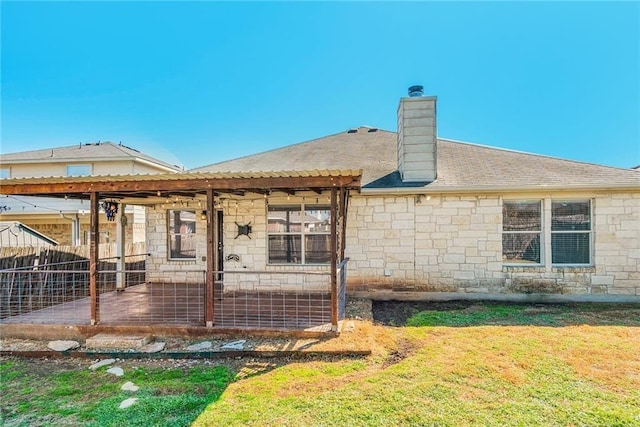 913 Cindy Ln, Leander, TX 78641 - back of house featuring a chimney, stone siding, and a patio area