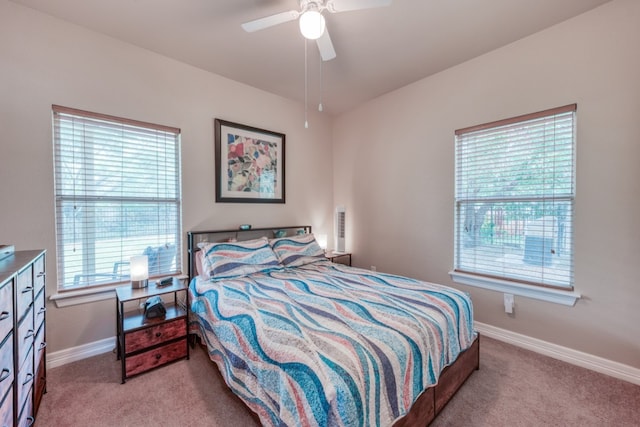 121 Cedar St, Granite Shoals, TX 78654 - bedroom with carpet floors, baseboards, and ceiling fan
