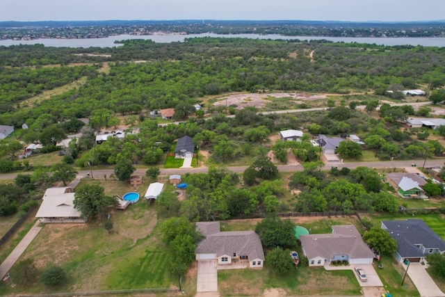 121 Cedar St, Granite Shoals, TX 78654 - view of property location with nearby suburban area, a nearby body of water, and a heavily wooded area