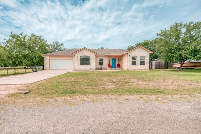 121 Cedar St, Granite Shoals, TX 78654 - ranch-style home featuring driveway, an attached garage, and stone siding