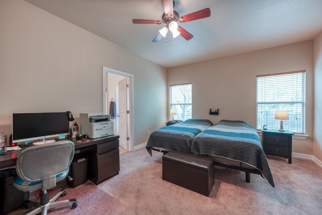 121 Cedar St, Granite Shoals, TX 78654 - bedroom featuring an office area, light carpet, baseboards, and a ceiling fan