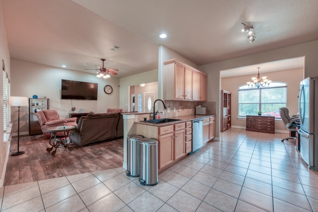 121 Cedar St, Granite Shoals, TX 78654 - kitchen with light brown cabinetry, appliances with stainless steel finishes, a sink, a chandelier, and light tile patterned floors