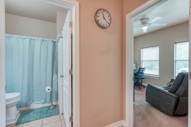 121 Cedar St, Granite Shoals, TX 78654 - full bath featuring curtained shower, a ceiling fan, toilet, baseboards, and tile patterned flooring