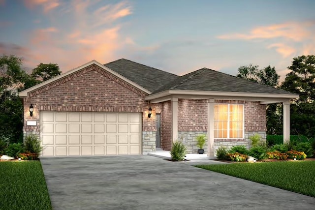 16917 Santiaguillo Trce, Manor, TX 78653 - view of front of house with concrete driveway, an attached garage, brick siding, roof with shingles, and stone siding