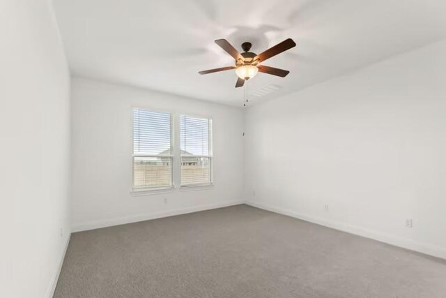 16917 Santiaguillo Trce, Manor, TX 78653 - empty room with a ceiling fan, baseboards, and carpet flooring