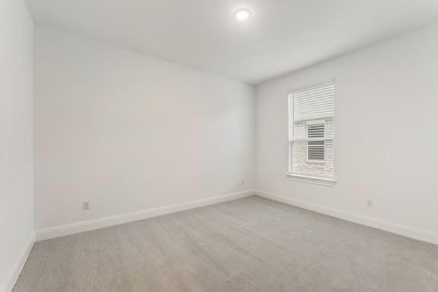16917 Santiaguillo Trce, Manor, TX 78653 - empty room with light colored carpet and baseboards