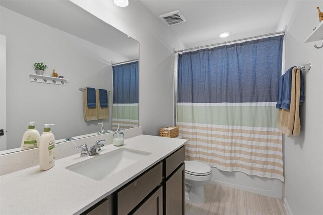 8212 Daisy Cutter Xing, Georgetown, TX 78626 - bathroom with toilet, vanity, and shower / bath combination with curtain
