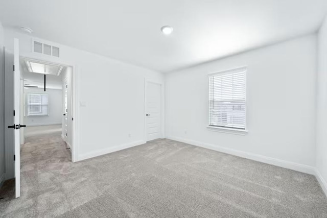 16921 Santiaguillo Trce, Manor, TX 78653 - unfurnished bedroom with attic access, carpet flooring, and baseboards