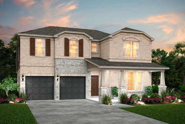 16921 Santiaguillo Trce, Manor, TX 78653 - view of front of house with a garage, concrete driveway, brick siding, a shingled roof, and stone siding