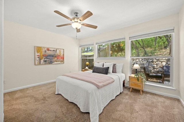 12214 Scribe Dr, Austin, TX 78759 - carpeted bedroom featuring baseboards and ceiling fan