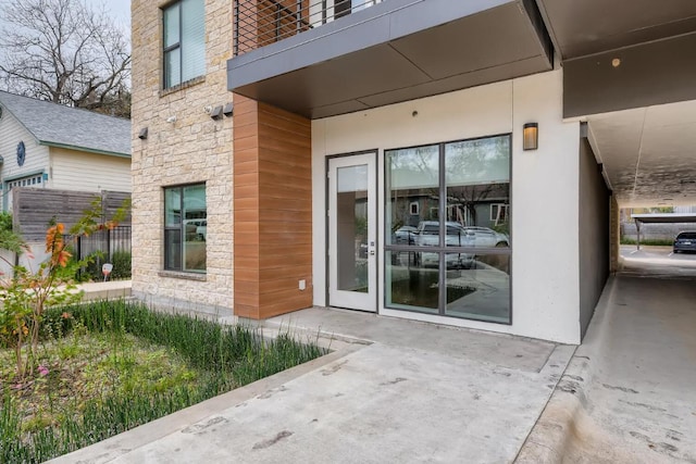 207 W Johanna Unit 108, Austin, TX 78704 - doorway to property featuring stone siding