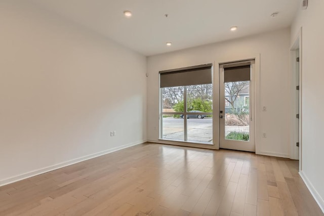 207 W Johanna Unit 108, Austin, TX 78704 - spare room featuring light wood finished floors, baseboards, and recessed lighting