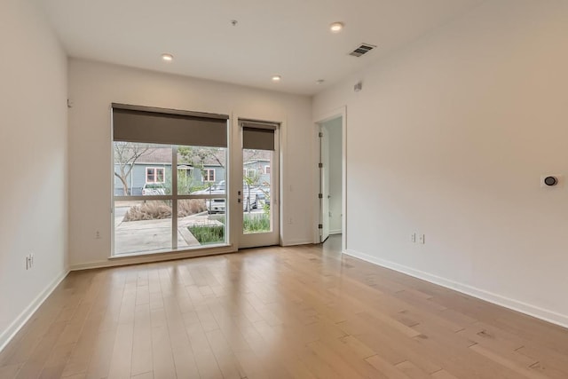 207 W Johanna Unit 108, Austin, TX 78704 - spare room featuring light wood-style floors, baseboards, and recessed lighting