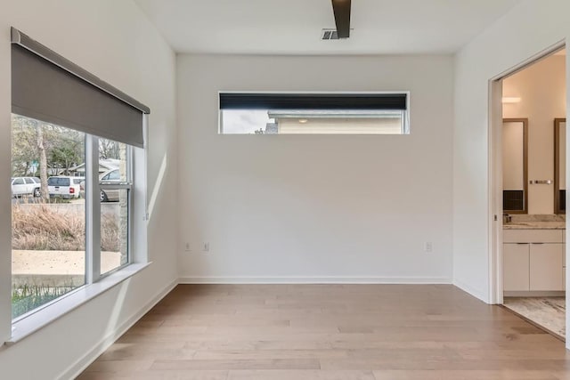 207 W Johanna Unit 108, Austin, TX 78704 - unfurnished room featuring healthy amount of natural light and light wood-style flooring