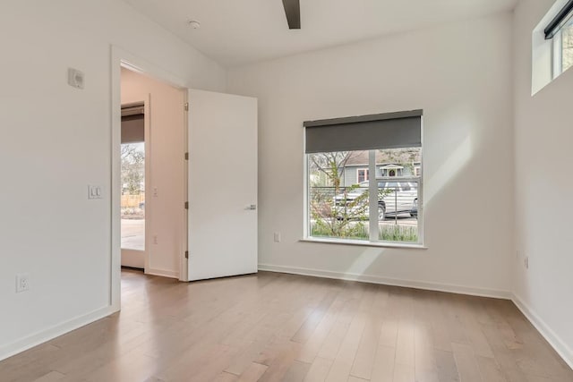 207 W Johanna Unit 108, Austin, TX 78704 - spare room featuring wood finished floors, ceiling fan, and baseboards