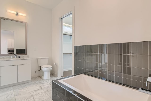 207 W Johanna Unit 108, Austin, TX 78704 - bathroom featuring a garden tub, vanity, and marble look tiles