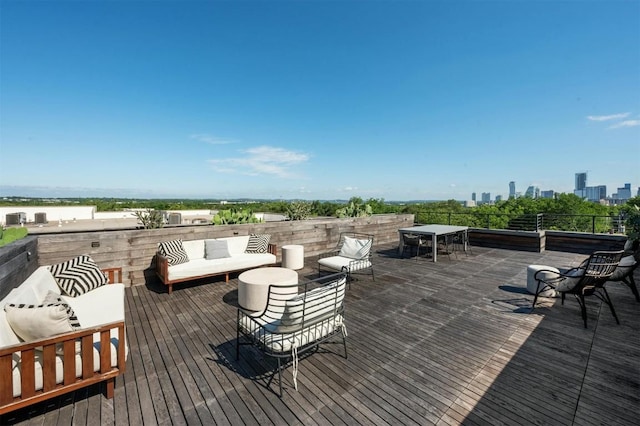 207 W Johanna Unit 108, Austin, TX 78704 - wooden deck featuring outdoor lounge area, outdoor dining area, and a view of city