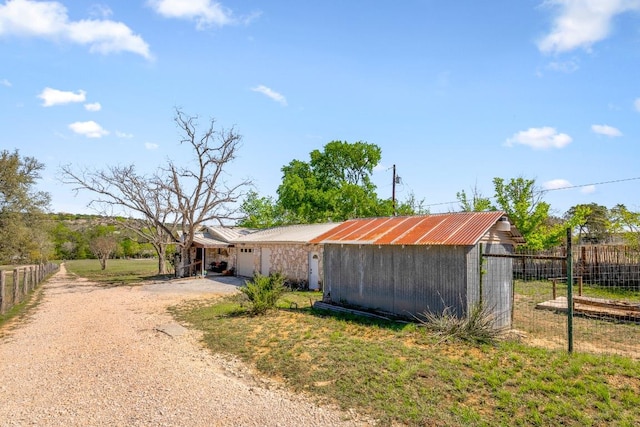 159 Baldwin Rd, Ingram, TX 78025 - view of outbuilding featuring driveway and a garage