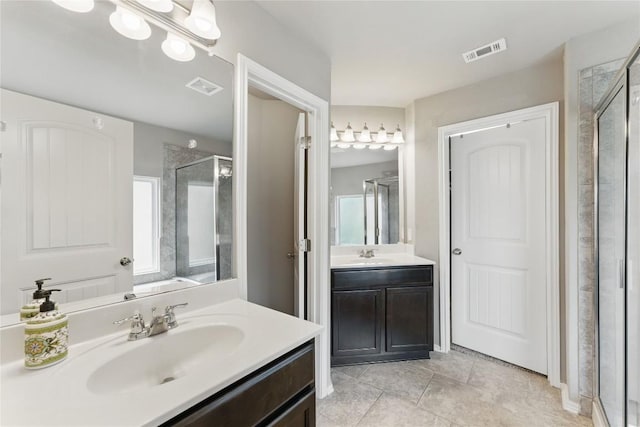 6739 Indian Lndg, San Antonio, TX 78253 - full bath with a stall shower, two vanities, and tile patterned floors