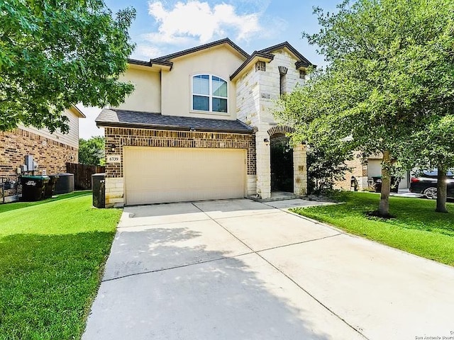 6739 Indian Lndg, San Antonio, TX 78253 - view of front facade with an attached garage, concrete driveway, stone siding, a front lawn, and stucco siding