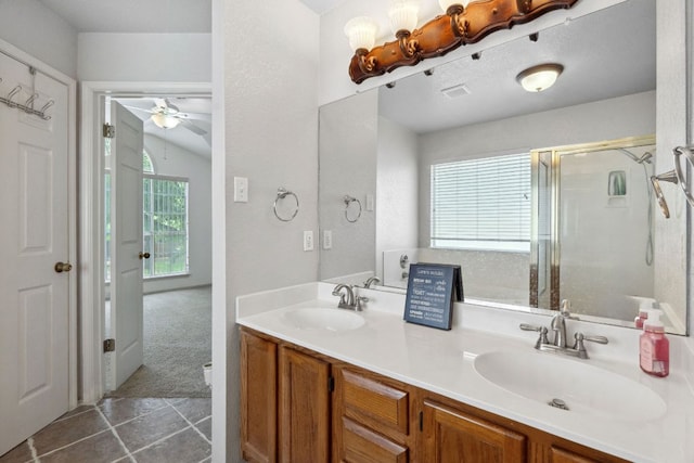 2917 Feathercrest Dr, Austin, TX 78728 - bathroom with a stall shower, double vanity, ceiling fan, and tile patterned floors