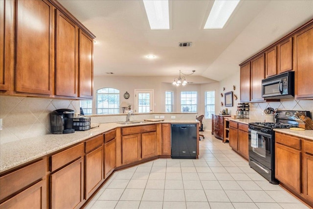 15115 Staked Plains Loop, Austin, TX 78717 - kitchen featuring black appliances, brown cabinets, a sink, backsplash, and lofted ceiling