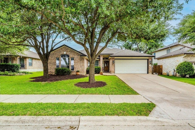 15115 Staked Plains Loop, Austin, TX 78717 - view of front of home featuring an attached garage, brick siding, and concrete driveway
