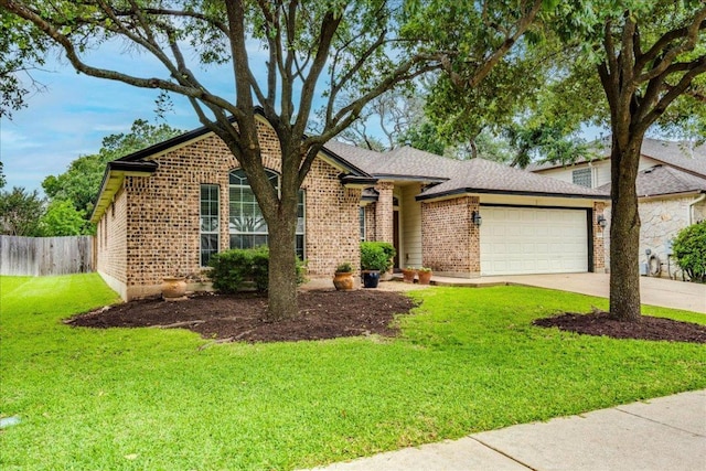15115 Staked Plains Loop, Austin, TX 78717 - view of front of property with brick siding, an attached garage, and driveway