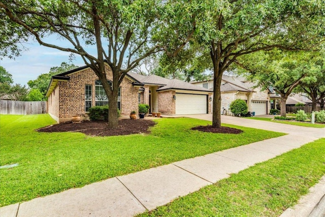15115 Staked Plains Loop, Austin, TX 78717 - view of front of house with an attached garage, brick siding, and concrete driveway