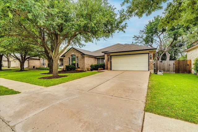 15115 Staked Plains Loop, Austin, TX 78717 - view of front of property featuring a garage, concrete driveway, brick siding, and roof with shingles