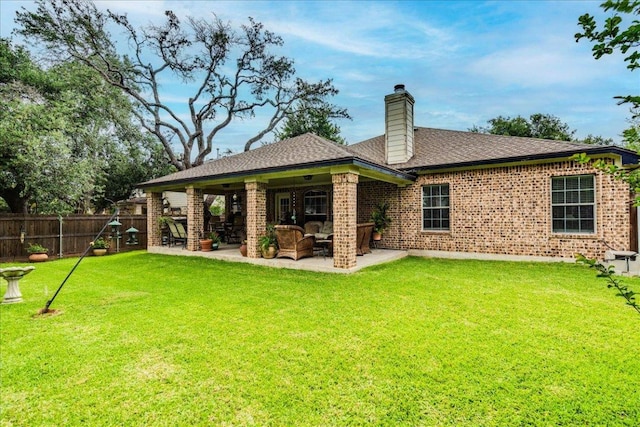 15115 Staked Plains Loop, Austin, TX 78717 - back of house featuring a patio, a chimney, brick siding, and a shingled roof