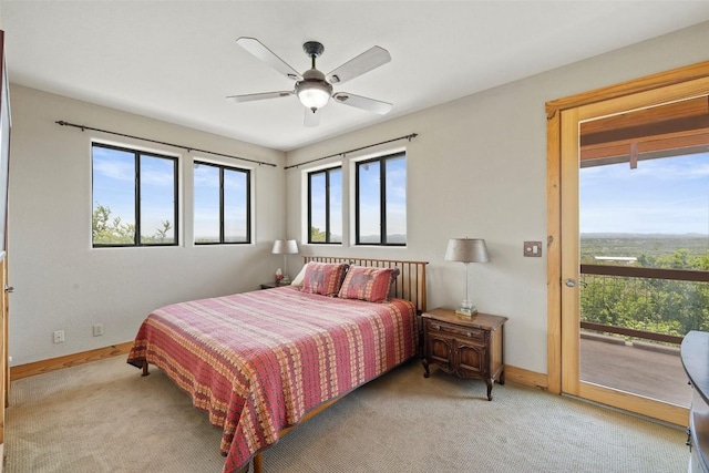 309 Cactus Trl, Johnson City, TX 78070 - bedroom with access to outside, carpet flooring, baseboards, and a ceiling fan