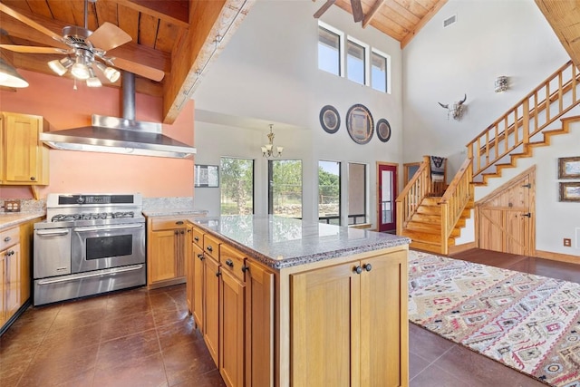 309 Cactus Trl, Johnson City, TX 78070 - kitchen with range with two ovens, wood ceiling with exposed beams, plenty of natural light, a chandelier, and a towering ceiling
