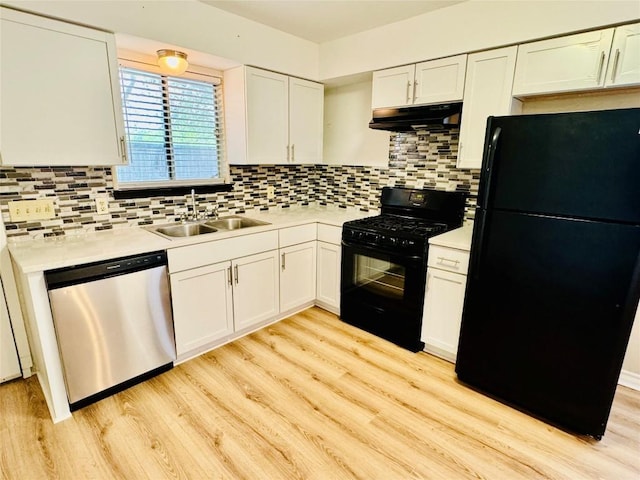 1320 Southport Dr, Austin, TX 78704 - kitchen with black appliances, under cabinet range hood, a sink, and light countertops